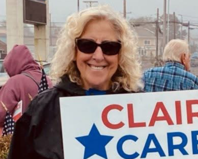 A HIGH-RANKING member of the Lincoln Co. Democrat Central Committee, Deborah Kozar Duus is a well-known activist who leads protests and rallies at a busy highway intersection in Newport.